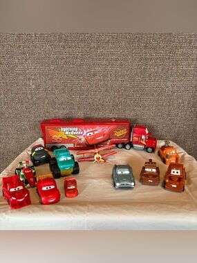 Disney Pixar Cars Planes Lot Of 12 Plastic Die Cast Mack Car Hauler Collectible